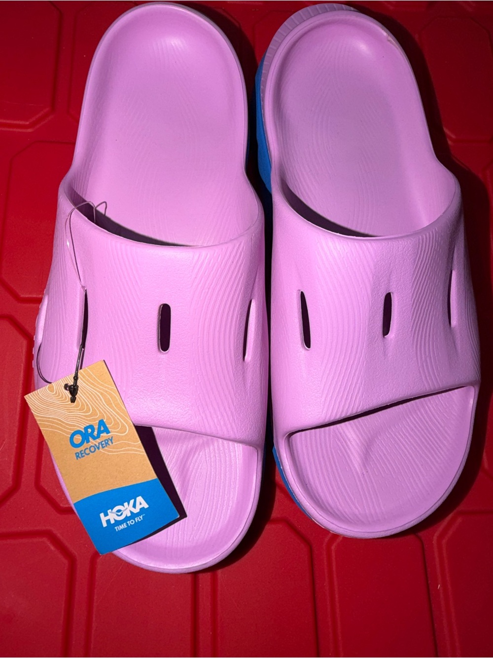 Hoka ORA Recovery Slide Sandals in Light Pink with Blue Accent